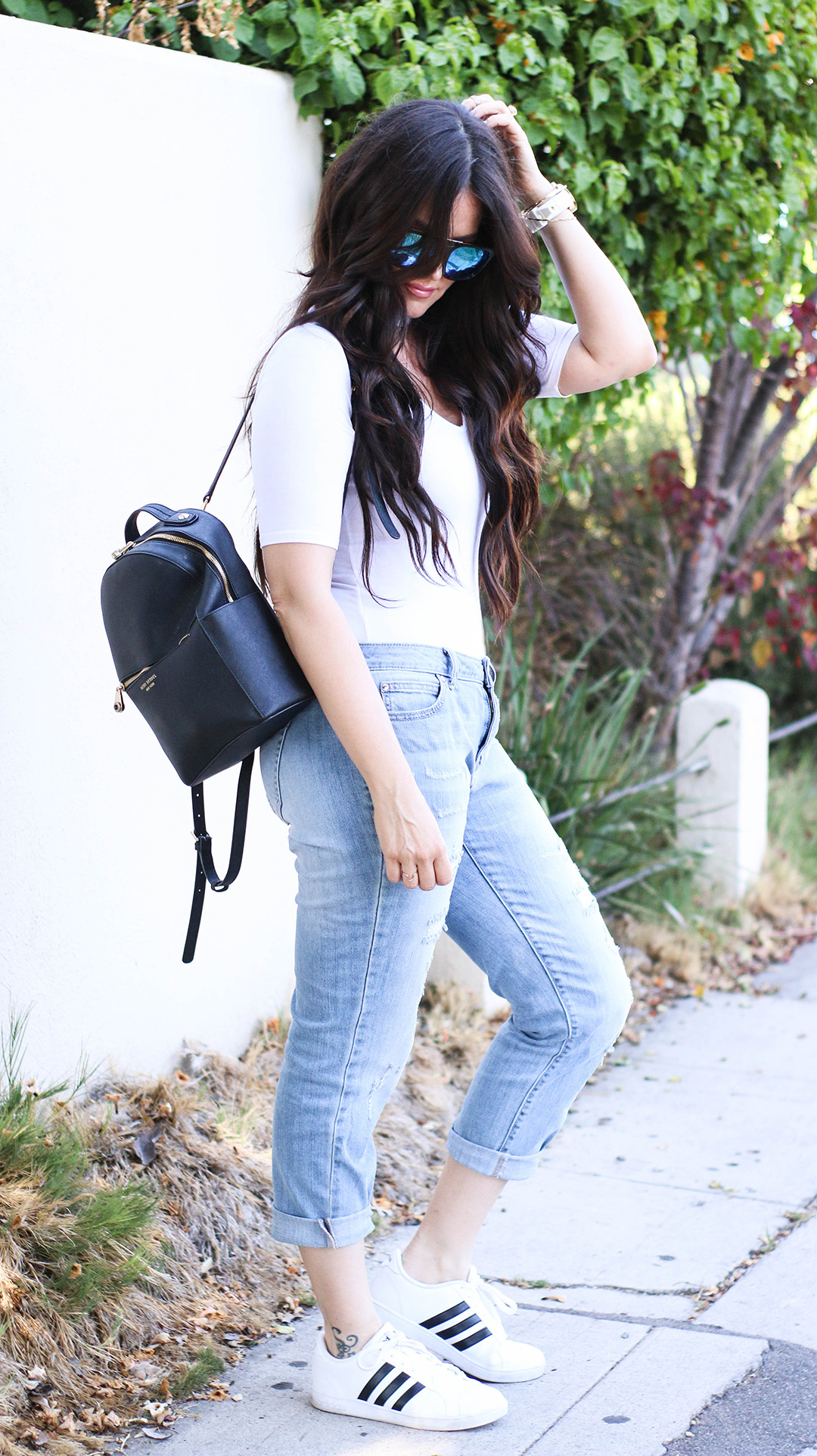 white body suit and boyfriend jeans